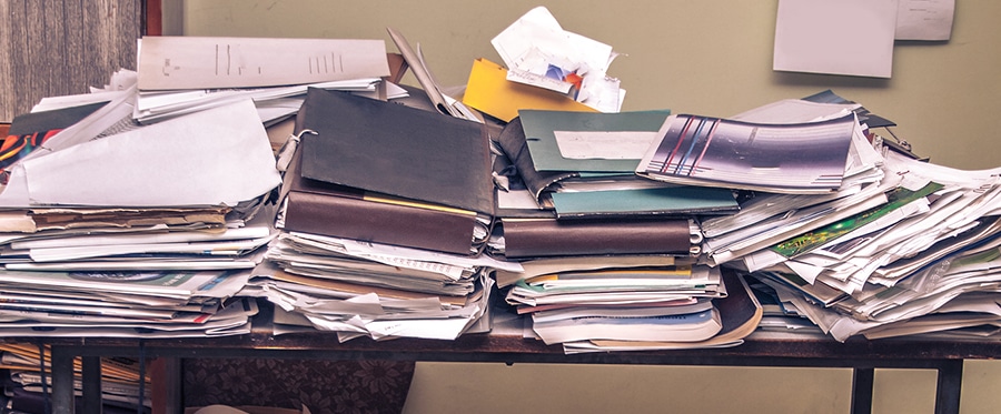 Pile of business files and papers for shredding